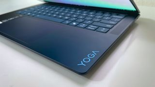 Close up of the "Yoga" logo on the keyboard deck of the Lenovo Yoga Slim 7x